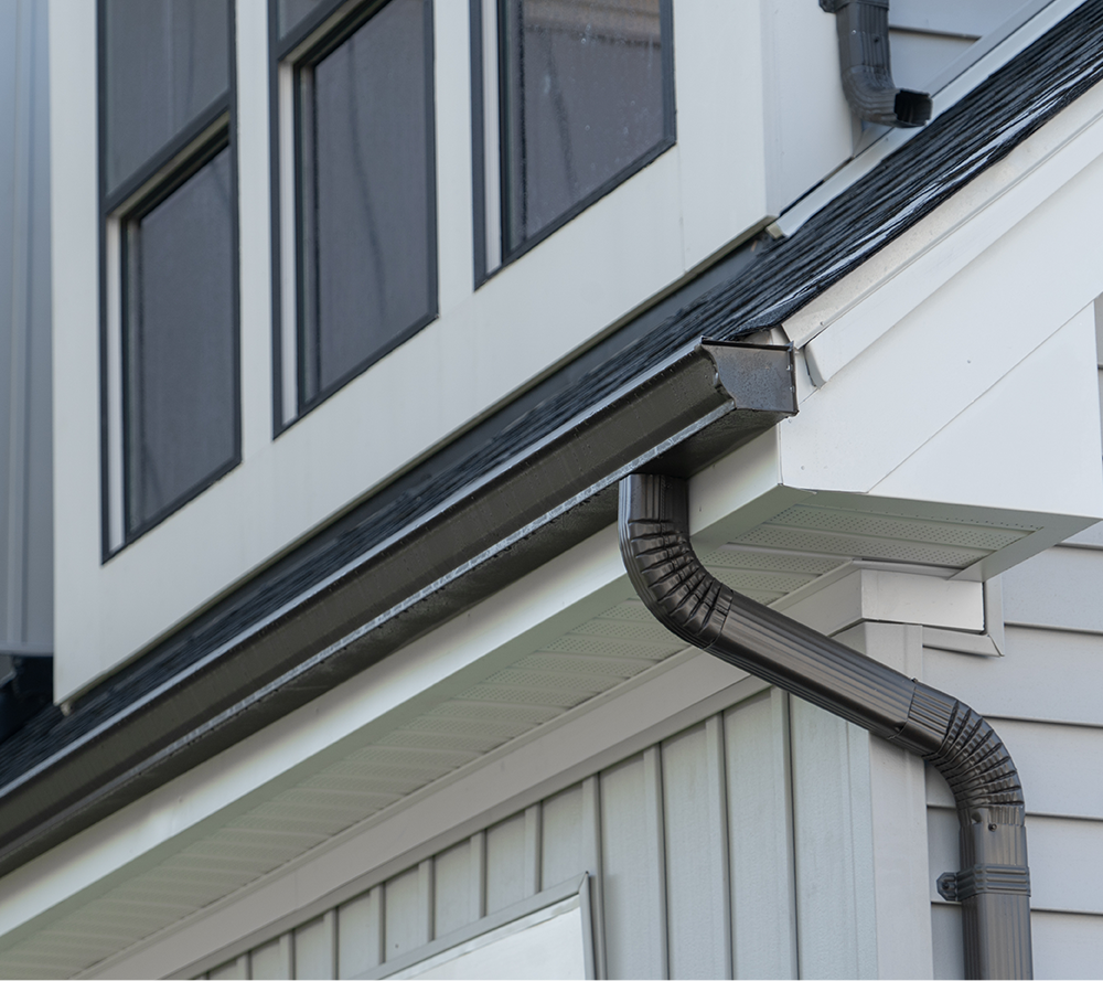 Seamless gutters and downspout on a home
